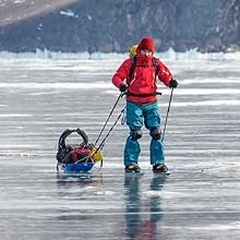 Man in the snow winter fishing