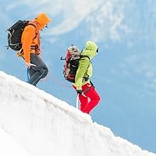 Two people climbing down after a hike