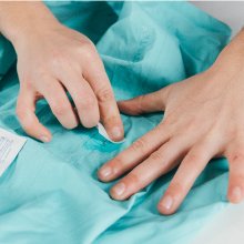 Cleaning around tear.